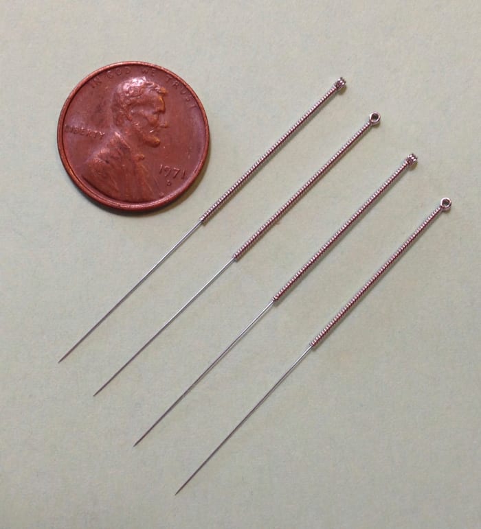 Acupuncture is a traditional Chinese medicinal technique that involves inserting small needles, shown above, into different points on the body.