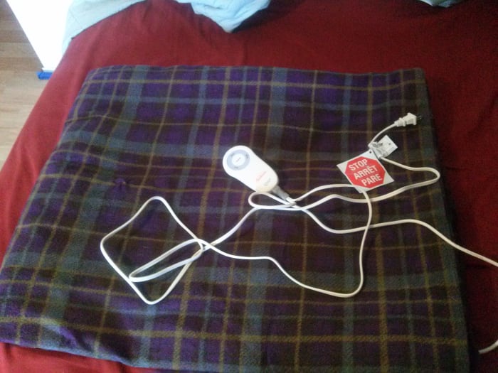 Electric throws come in all shapes and fabulous colors...so you don't have to get one that's purple/brown/silver plaid... They can also save money too on your heating bill!