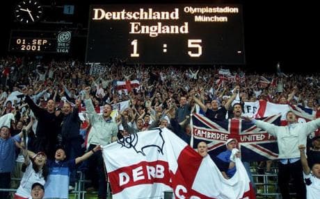English fans celebrate in München, Germany, as England plays Germany in a 2002 World Cup qualifier. The 5-1 victory for England helped the nation finished ahead of Germany in its qualifying group on goal difference.