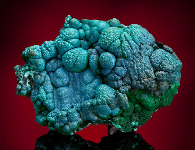 An unpolished chrysocolla stone. Use this stone to boost confidence and remove negative emotions.