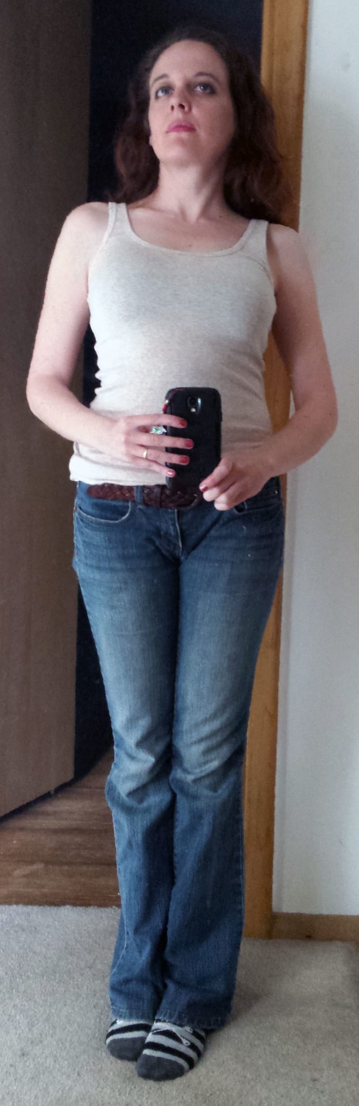 Check out my shoulders. The left is higher than the right, and you can see how my body is slightly twisted as well. That's all because of how my spine is abnormally curved.