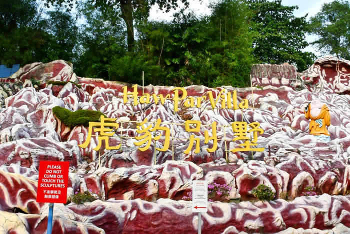 The entrance sign of Haw Par Villa offers a hint of the macabre attractions found within the statue park.