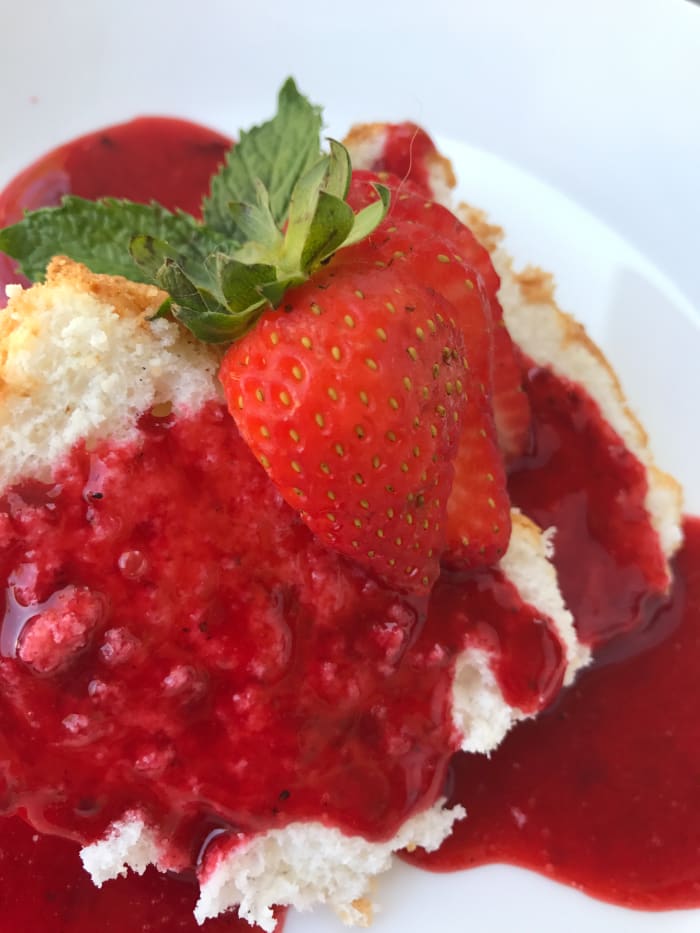 Served on its own or with a simple dessert sauce like this strawberry, homemade angel food cake is a glorious winner!