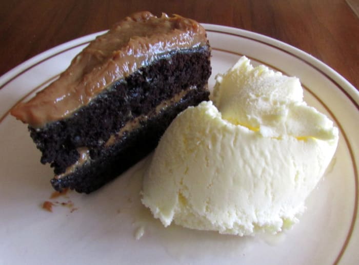 Learn how to make this two-layer chocolate cake with dulce de leche filling at home from scratch.
