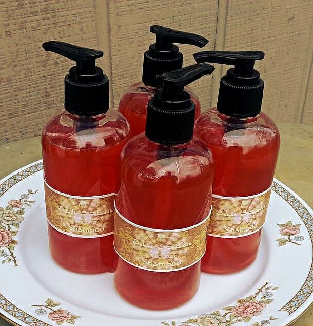 Homemade Shampoo All Dressed Up in Nice Bottle. The color is normally amber, but this batch took in a more reddish tint due to the addition of a little dark patchouli essential oil.