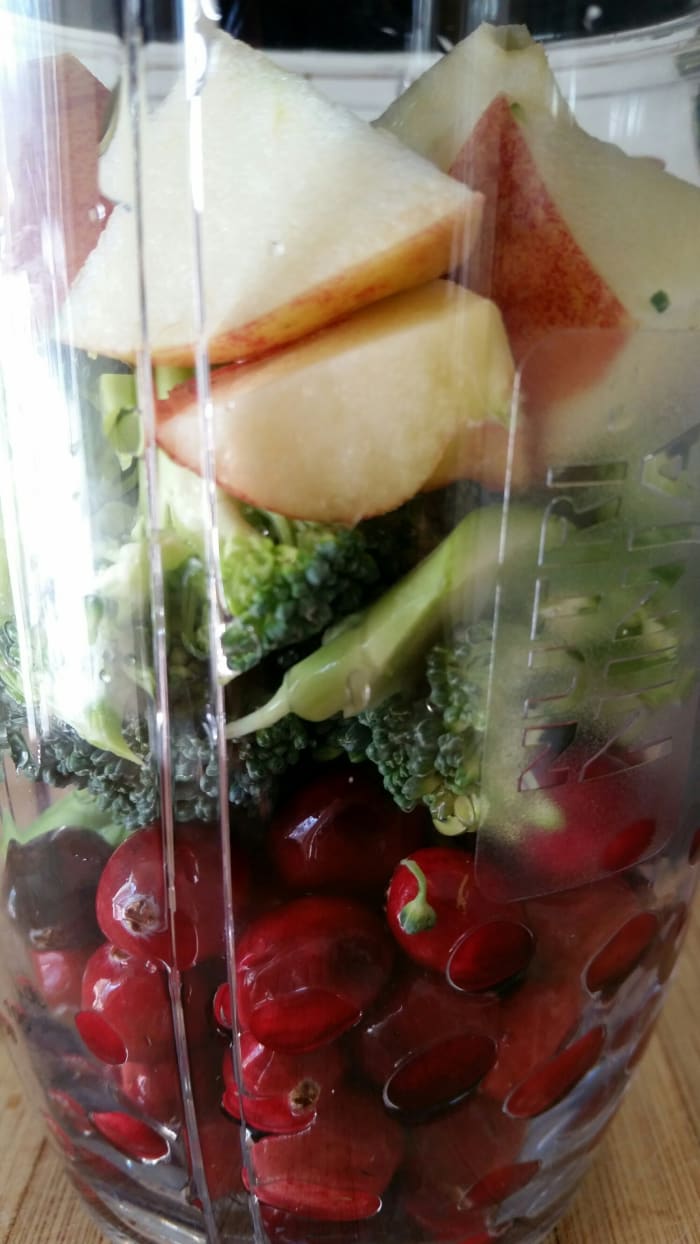 Cranberries, broccolli, and apples. Top it off with some grape juice for a delicious smoothie.