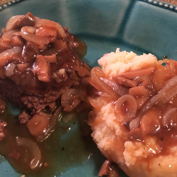 Venison Salisbury Steak with Onion and Mushroom Gravy (pictured with a pile of mashed potatoes).