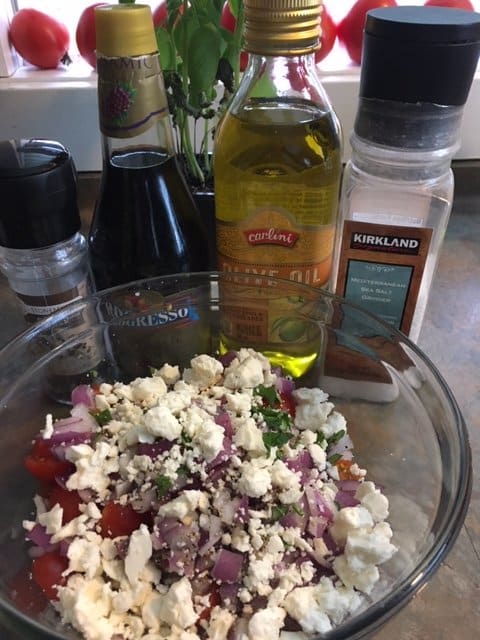 Pour blended olive oil and vinegar over tomatoes, mix gently, refrigerate for about an hour and enjoy!