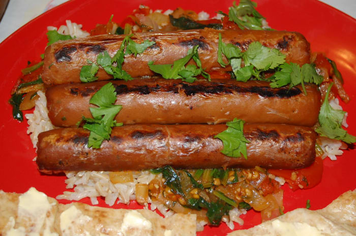 Sausages aren't limited to being eaten in a hotdog bun! Why not try something a little different? I served these Quorn Chicken and Apple Sausages with rice.