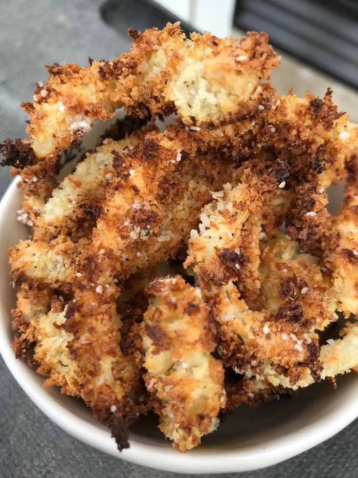 Crispy, crunchy onion rings with gorgeous flavor, without the fat of deep frying. These onion rings are breaded and baked at a high temp for perfect results.