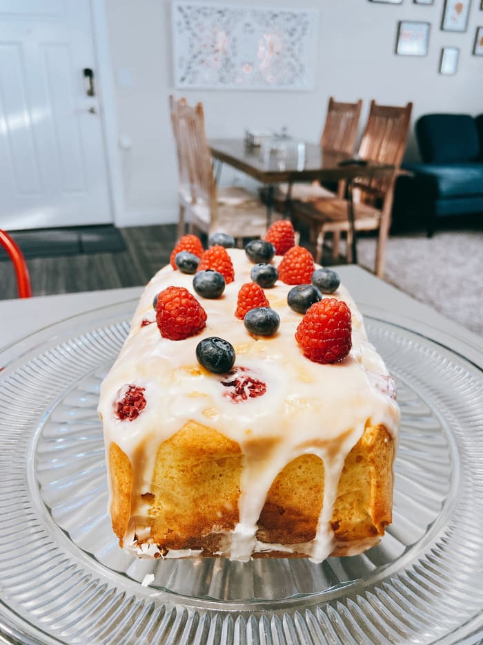 The bread looks scrumptious and beautiful with the bright red and purple colors from the fresh raspberries and blueberries.