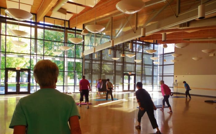 Being part of a small exercise group makes fitness a more meaningful part of life. The women in this photo are working with dumb bell weights.