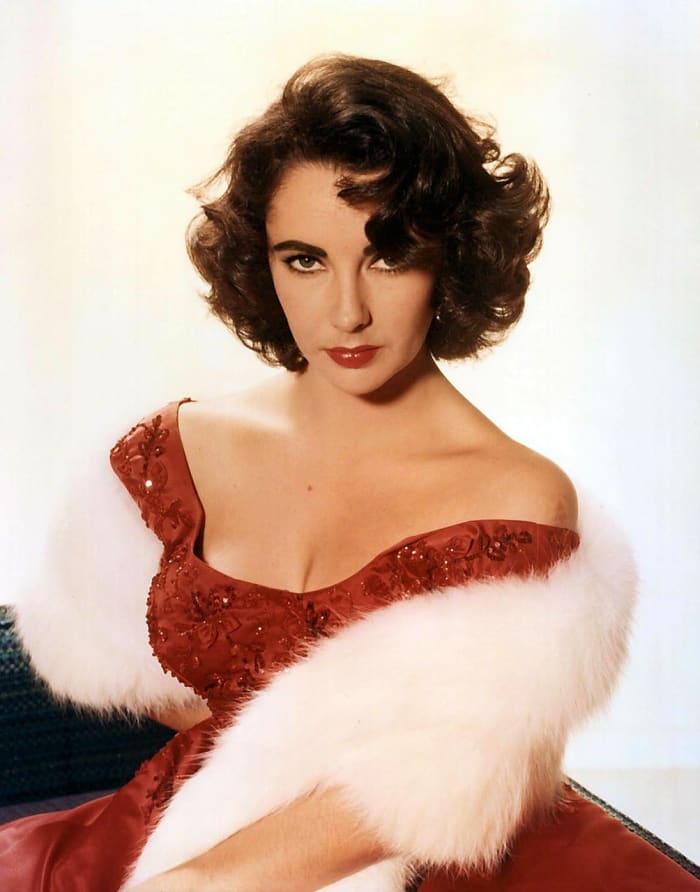 Well, okay.....just because Ms.Taylor had six, seven, eight husbands, doesn't mean she shouldn't have worn the red dress as often as she did!