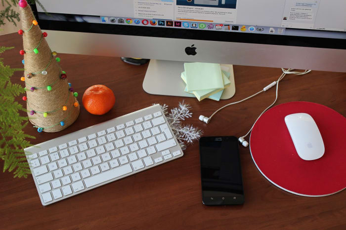 Are you stuck in the office over the holidays? Cheer yourself and make the most of your time at work with these tips!
