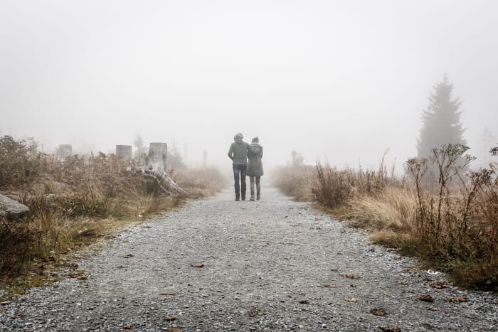 Being in love means being able to walk forward into the unknown together, knowing that you've got each other to hold onto when things get rough.