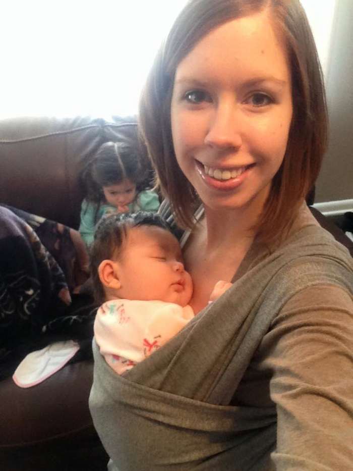 A baby wrap can make it easier to keep up with older kids while also caring for a newborn.