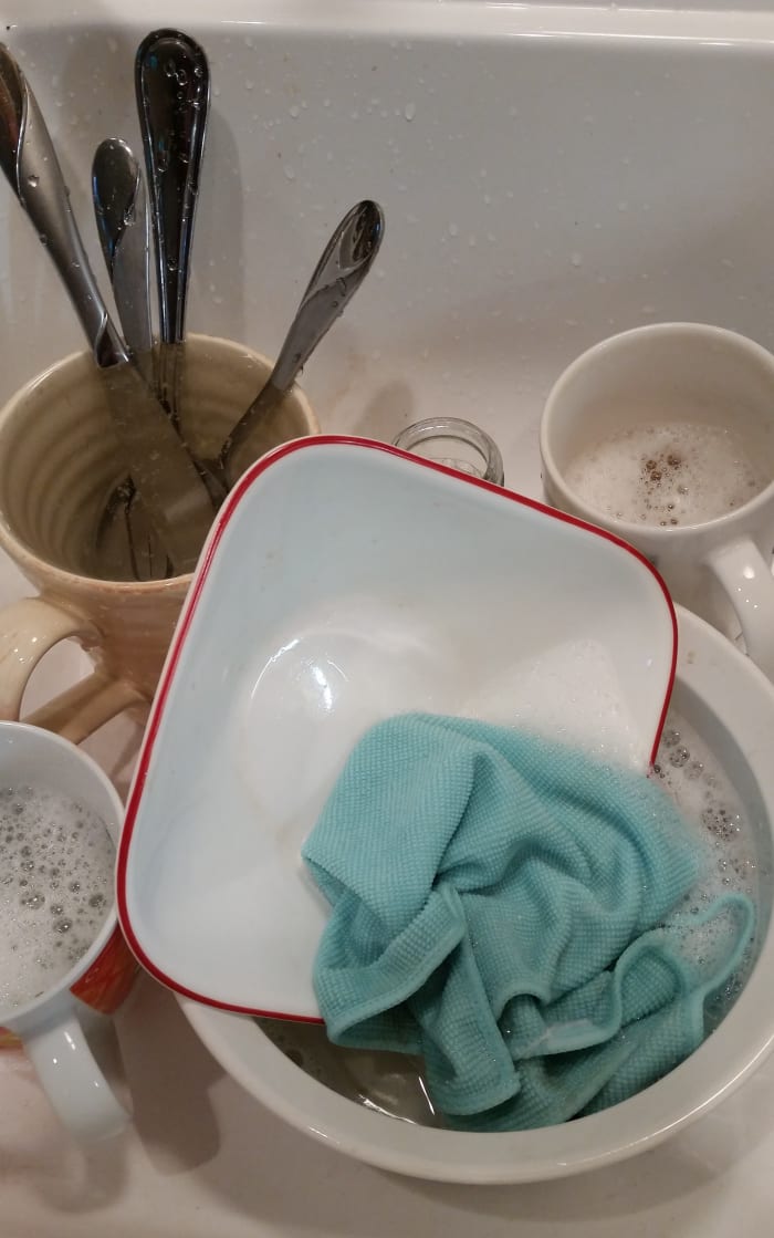 I use a mixing bowl or a cooking pot as my dish pan and put just an inch or two of water when I start.