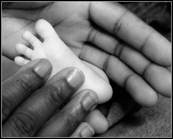 Photograph a baby to emphasise how tiny they are. Parents will often buy these pictures.
