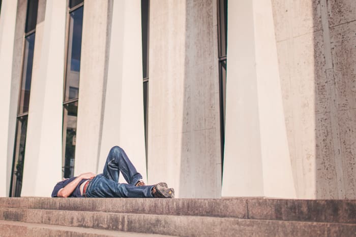 Can you guess the identity of this man? He is lazing around, not working. He is a lazy man. But he may not be a lazy bum.