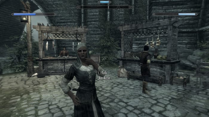 The NPC is now wearing a hood to keep out the rain, added by Wet and Cold an excellent Skyrim mod.