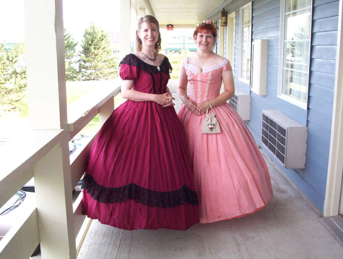 My sister made the dress on the left; the dress on the right is the same one shown above, now worn by my friend Joan, who heard me talking about reenacting and wanted to try it out. I have cool friends!