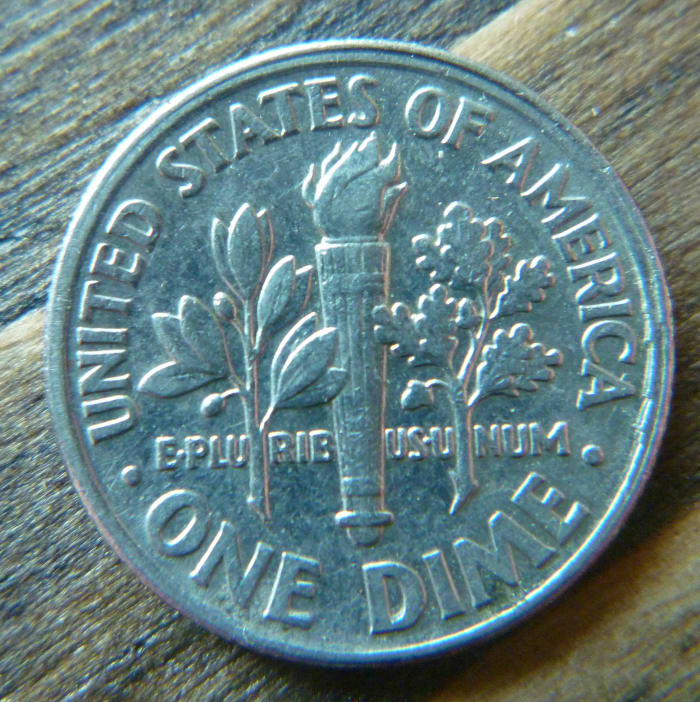 1995 Roosevelt Dime Struck Slightly Off Center. The off center strike can be observed near the top of the coin where there are two rim marks.
