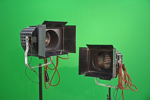 Close up of typical fresnel lights, showing the barn doors which adjust the width of the beam of light. In stage work, they are typically hung, and not on tripods