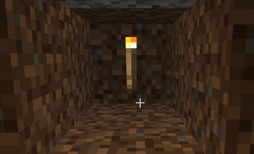 Dig a hole in the wall of your farm, and place the torch back in it. This helps keep the lighting low.