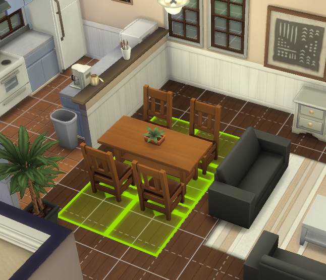 Being able to move items that go together in one group makes things easier. The green highlighted grid shows the space the items need for Sims to properly use them.