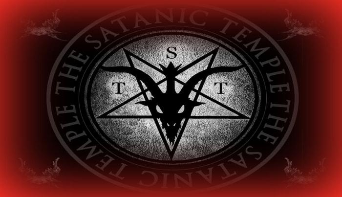 The logo of The Satanic Temple features a winged goat-headed devil within a pentagram.