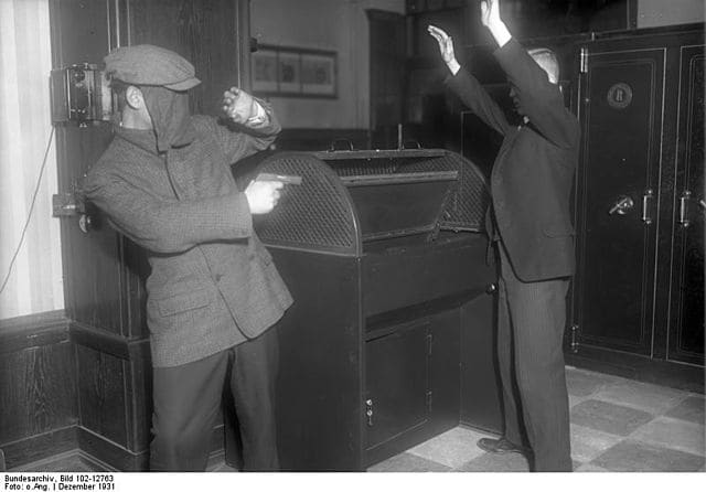 Masked man threatens a private citizen. This photo has to be a classic.
