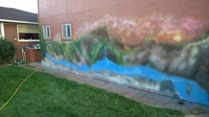 This is a mural I painted on my garage to give myself a place to go where I felt as if I were looking off into the distance. It is a montage of sights I've seen over the years.