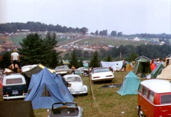 Tents and cars of spectators at Woodstock.