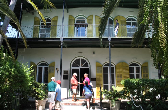 Hemingway House, Key West, Florida, USA. Picture shows the author's wife and daughter at the entrance to Hemingway House.