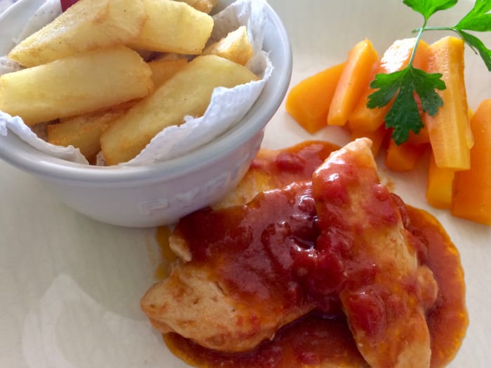 My Daughter's Lunch: Chicken fillets in a sweet tomato and black olive sauce with homemade chips and carrot sticks.