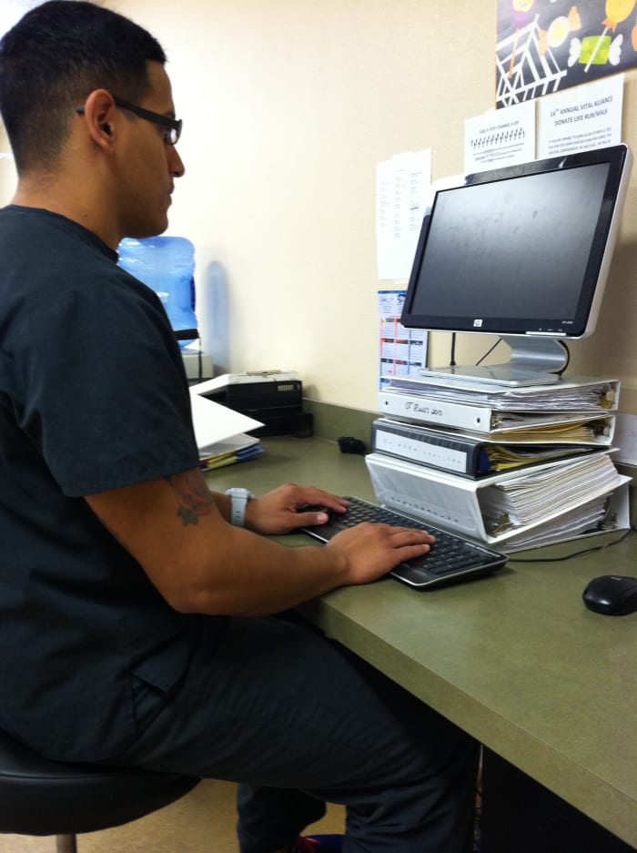 The monitor should be around eye level, the ears in line with the shoulders, arms at the sides, and the elbow angles opened up from 90 degrees.