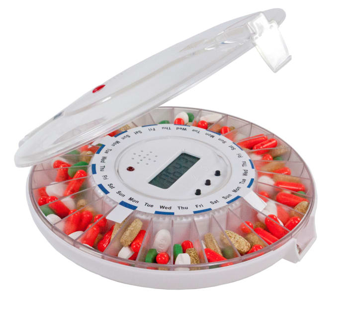 Automatic pill dispenser with alarm and compartments for every day of the week, bracketed off by morning, noon, evening, and bedtime.