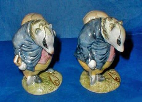 (Left) Beswick Beatrix Potter Tommy Brock BP 3a. (Right) Beatrix Potter Tommy Brock BP 3a—Very Rare Second Version, Handle Hidden, Small Eye Patch.