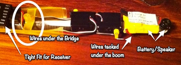 Ah! Everything in place. I just need to tack the servo wires out of the way. Note how the wires all are routed UNDER the bridge. A small dab of CA glue applied with the tip of a pin is just enough to hold the wires in place.