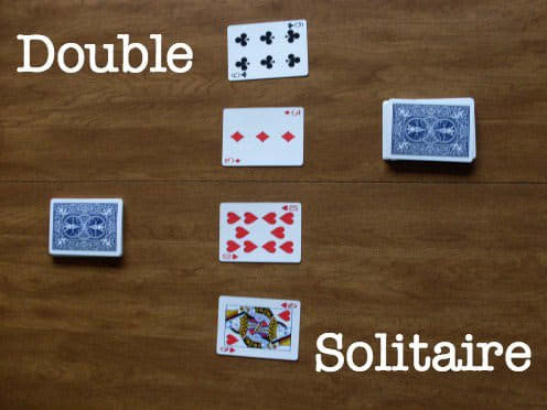 Here you see how the game should look before anyone has taken a turn. There are two draw piles with four cards in the center.