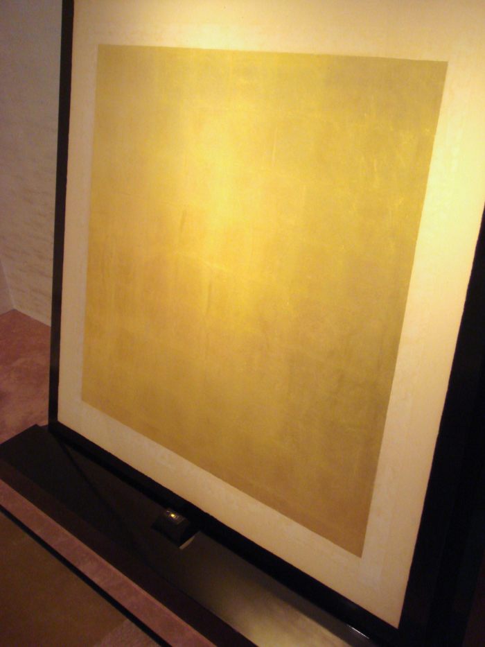 A gold nugget of 5 millimeters (0.20 in) in diameter (bottom) can be expanded through hammering into a gold foil of about 0.5 square meters (5.4 sq ft).