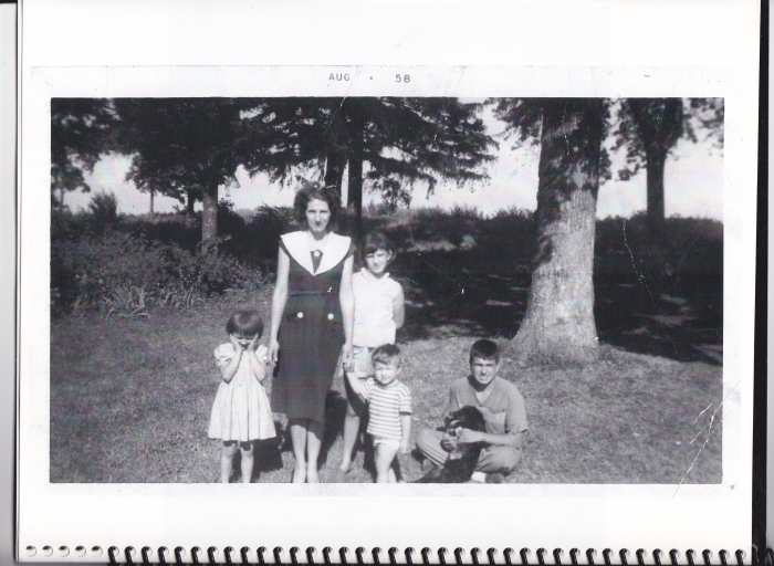 Picture taken in 1958 in our front yard. From left to right: sister Patty, mom, sister Beatrice, brother Philip, and the author with dog sitting.
