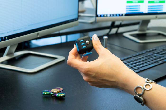 The fidget cube being used in an office. Small and discreet. I would have shown you mine, but I lost it somewhere.
