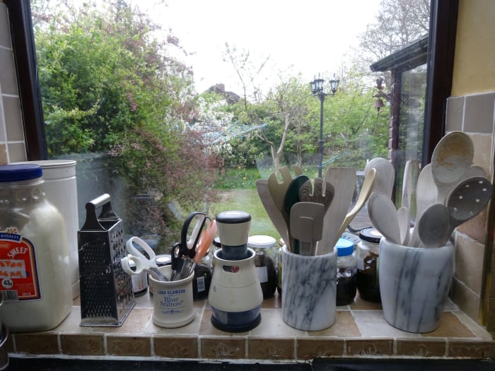 Just behind the kitchen utensils that we keep on the window sill are all the jars filled with eucalyptus leaves and olive oil, kept in the sunshine, while the eucalyptus oils infuses into the base olive oil.