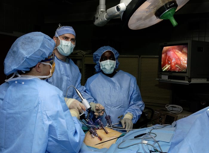 During laparoscopic surgery, multiple ports are inserted into the abdomen through small incisions. Then carbon dioxide is blown into the abdomen to make room for the surgeon to operate.