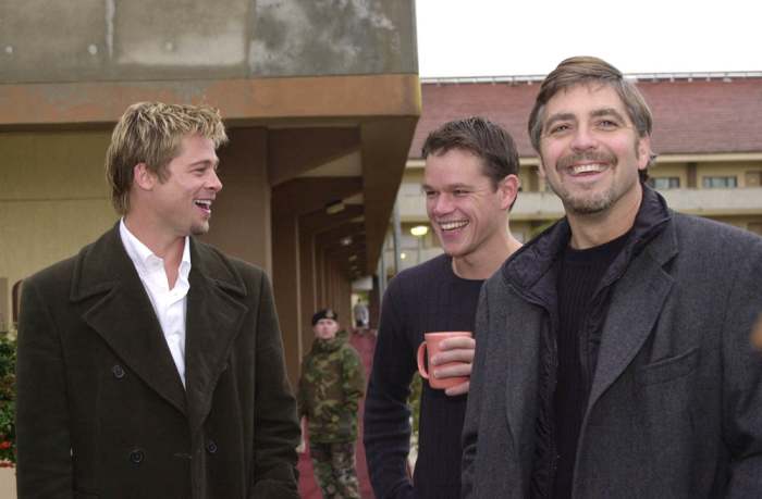 Clooney, Pitt, and Damon ham it up for the camera.