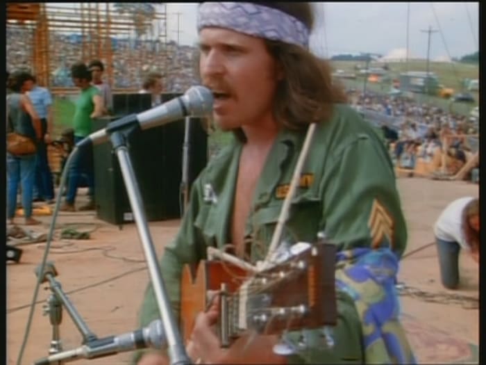 Country Joe McDonald onstage at Woodstock