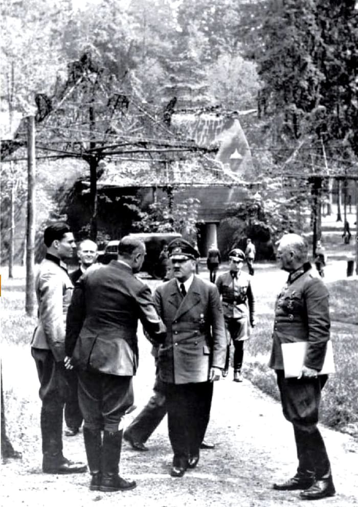 Claus von Stauffenberg (Left) alongside Adolf Hitler (Middle) and various Nazi officers. This photo was taken only a few minutes before Operation Valkyrie went into effect.