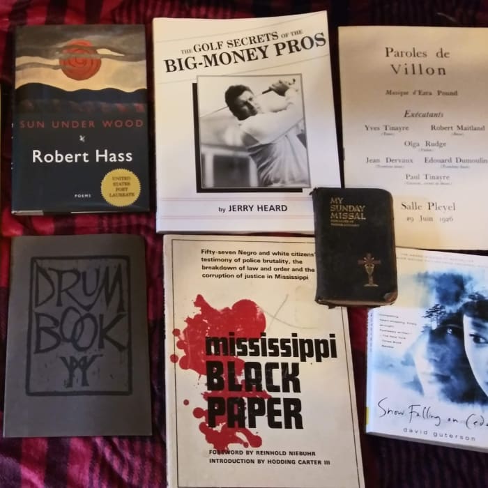 A sampling of used books a bookseller might have waiting to be priced