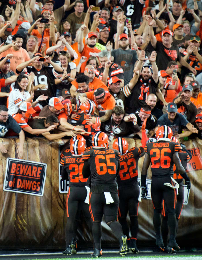 Members of the Cleveland Browns celebrate with fans after they beat the New York Jets at FirstEnergy Stadium to snap a 19-game winless streak.